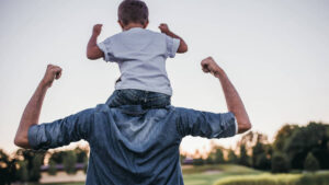 A man carrying a child